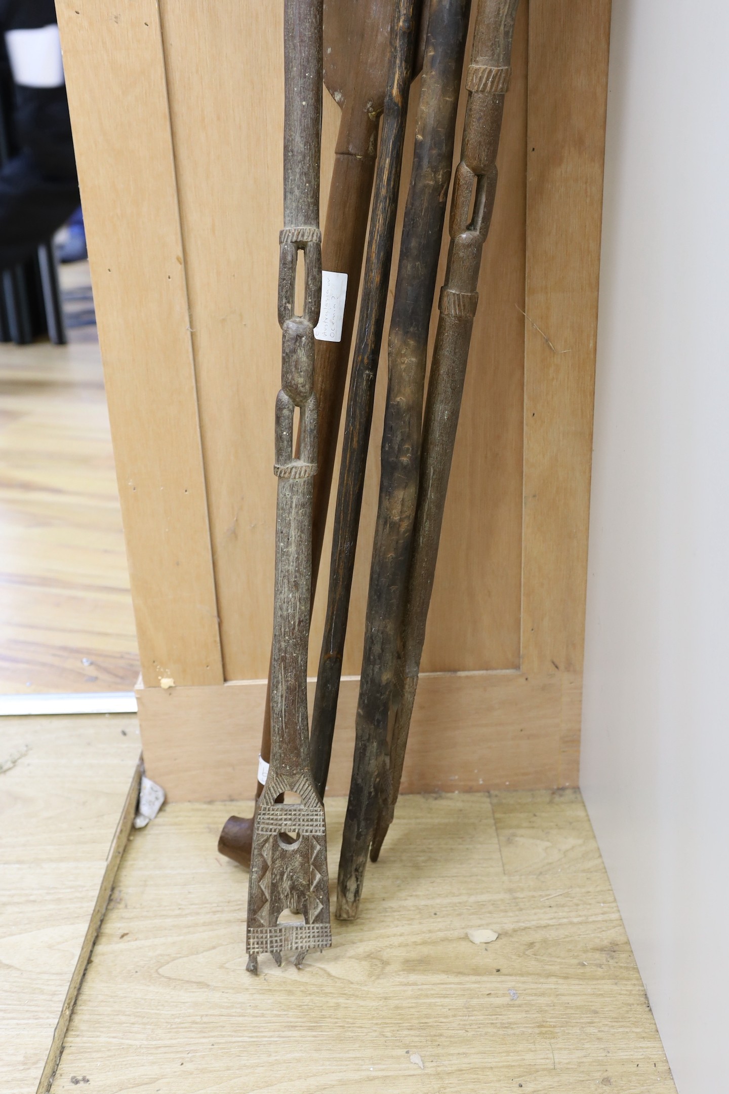 A Dayak spear paddle and four Papua New Guinea spears